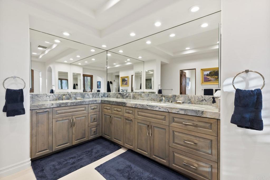 3226 Violet Ridge Encinitas, CA 92024 - Photo 43 of 54 a large bathroom with a large mirror vanity and sink