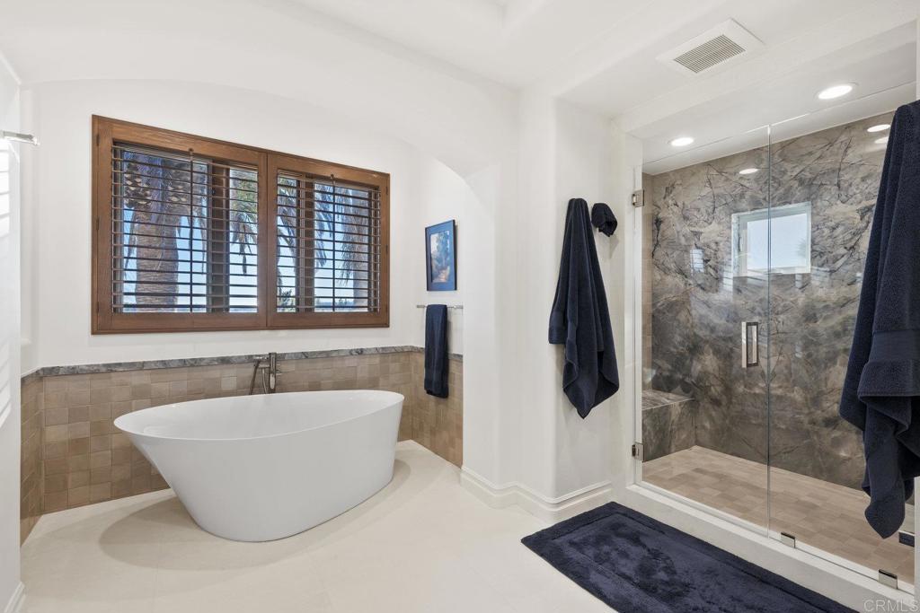 3226 Violet Ridge Encinitas, CA 92024 - Photo 44 of 54 a bathroom with a bathtub and shower