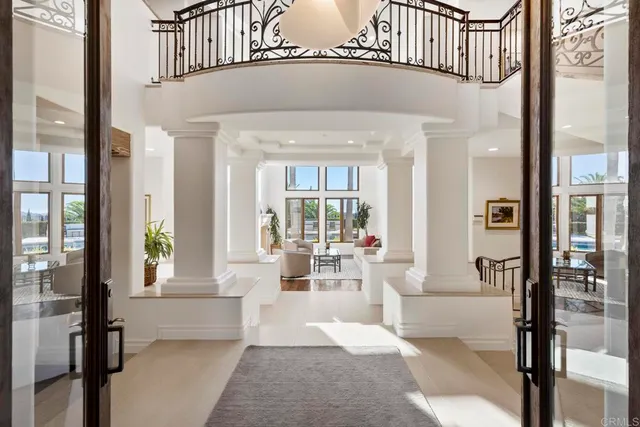 a view of staircase with white walls and a potted plant