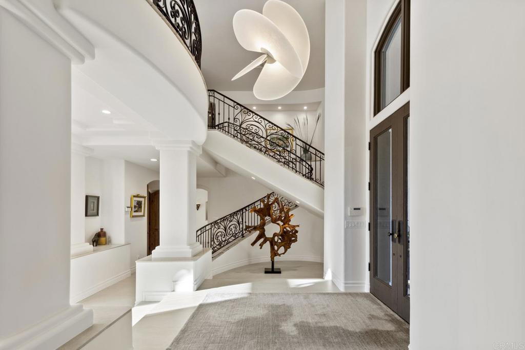 3226 Violet Ridge Encinitas, CA 92024 - Photo 9 of 54 a view of staircase with white walls and a potted plant
