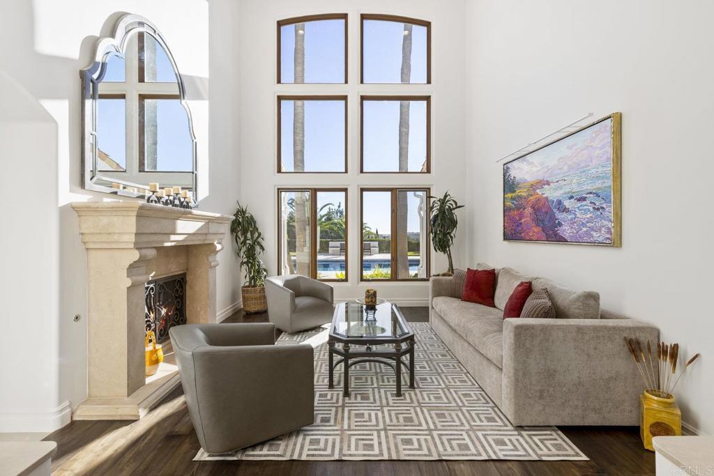 3226 Violet Ridge Encinitas, CA 92024 - Photo 10 of 54 a living room with furniture a fireplace and a large window