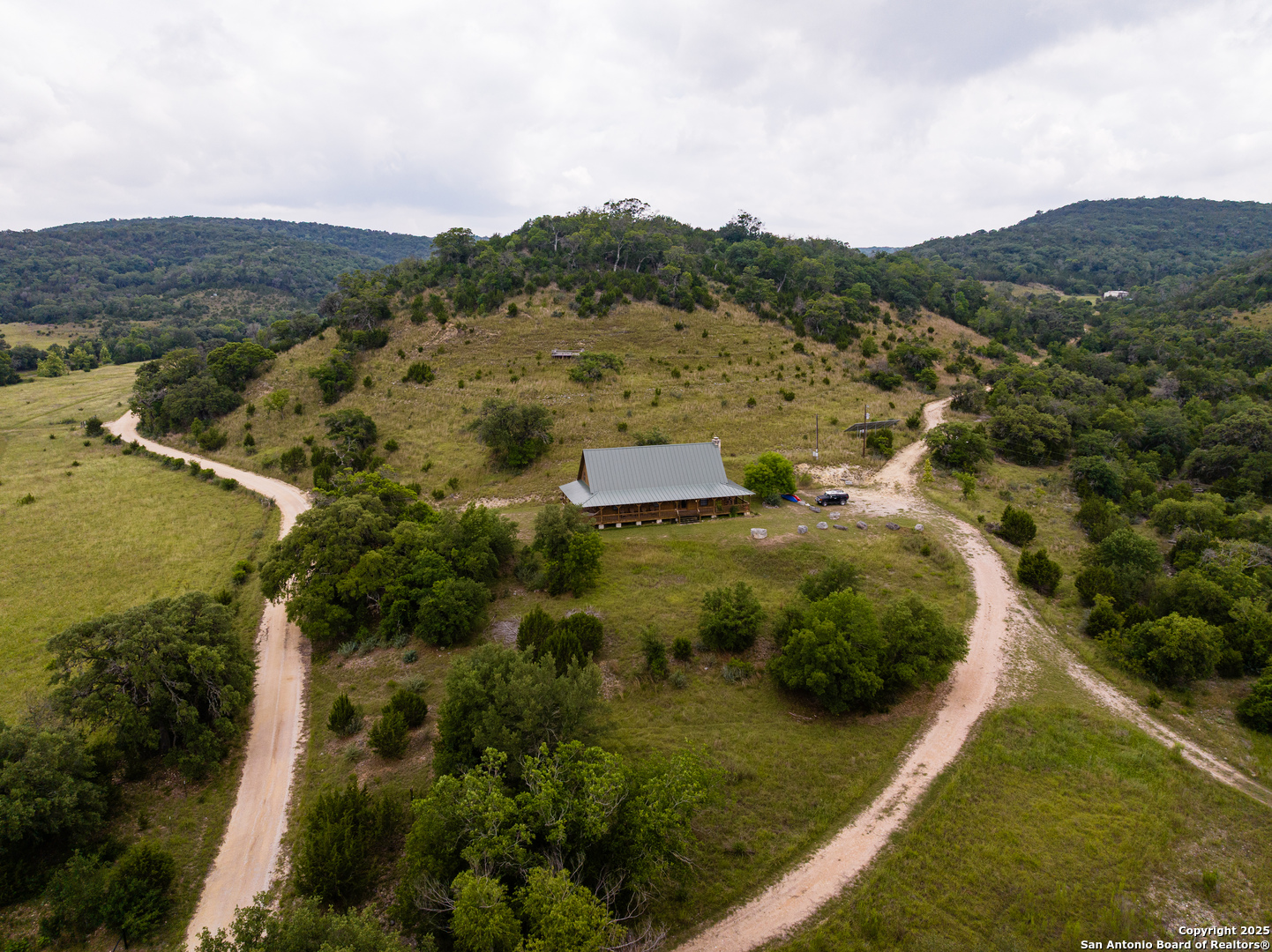 1616 Mickle Creek Road Medina, TX 78055 - Photo 12 of 18 a view of a lake with mountains in the background