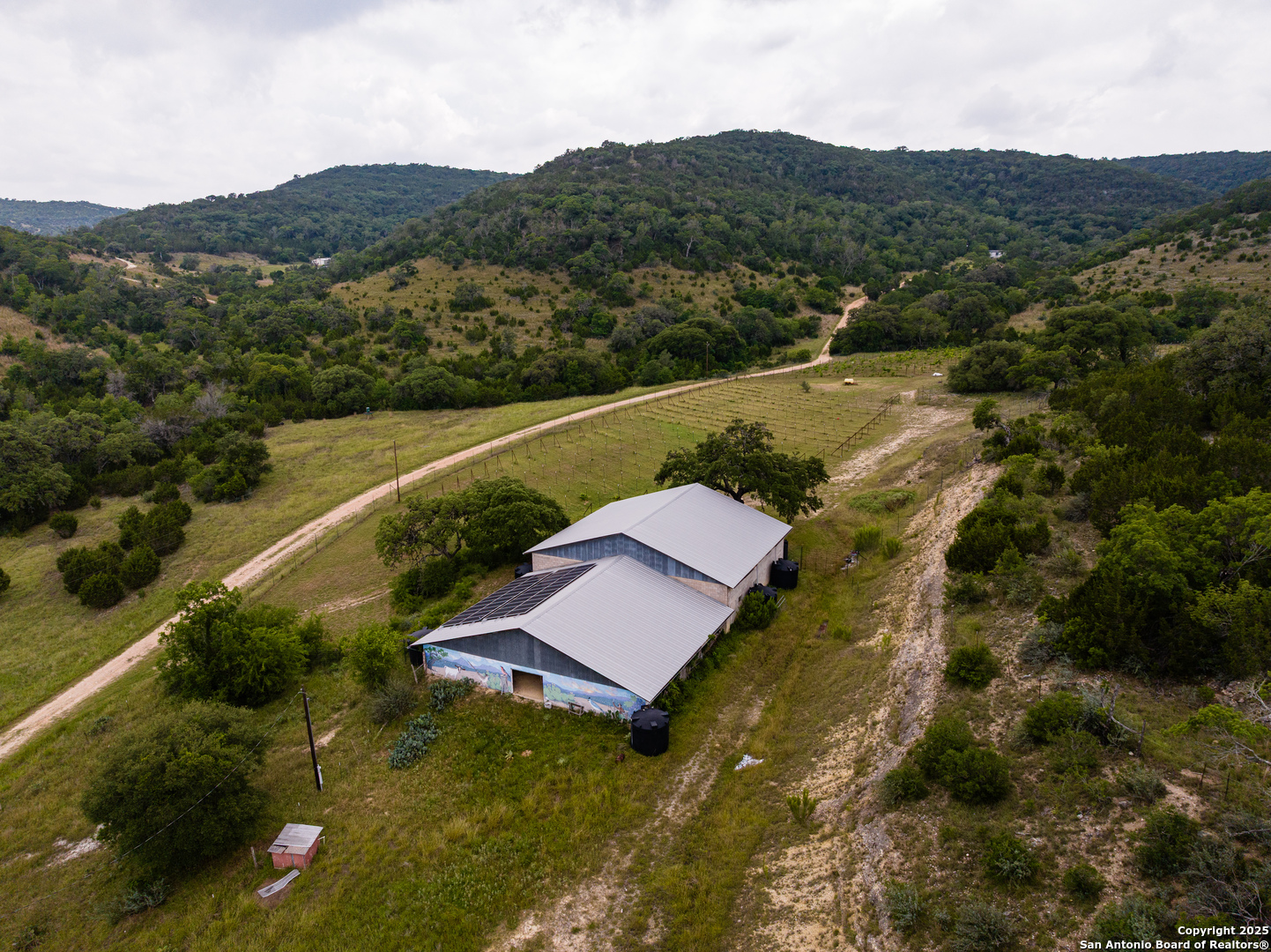 1616 Mickle Creek Road Medina, TX 78055 - Photo 13 of 18 an aerial view of residential houses with outdoor space and trees