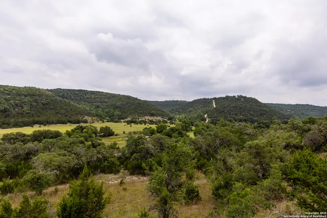 a view of a city with mountains in the background