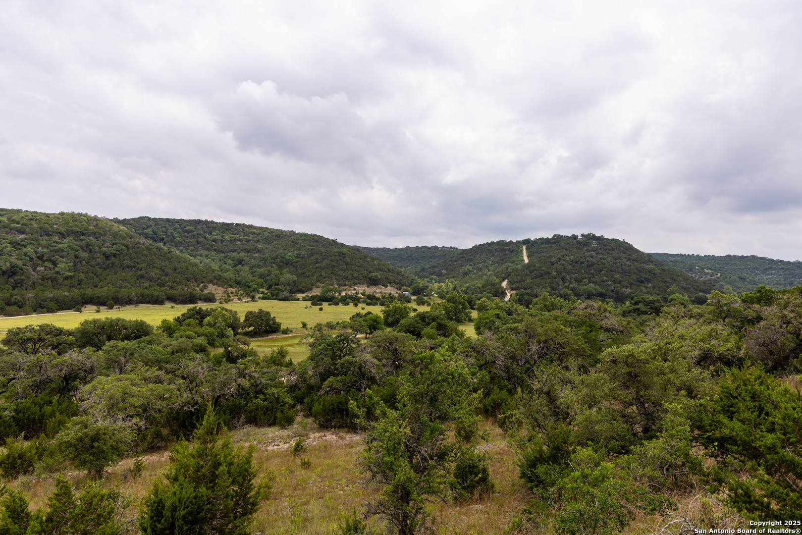 1616 Mickle Creek Road Medina, TX 78055 - Photo 3 of 18 a view of a city with mountains in the background