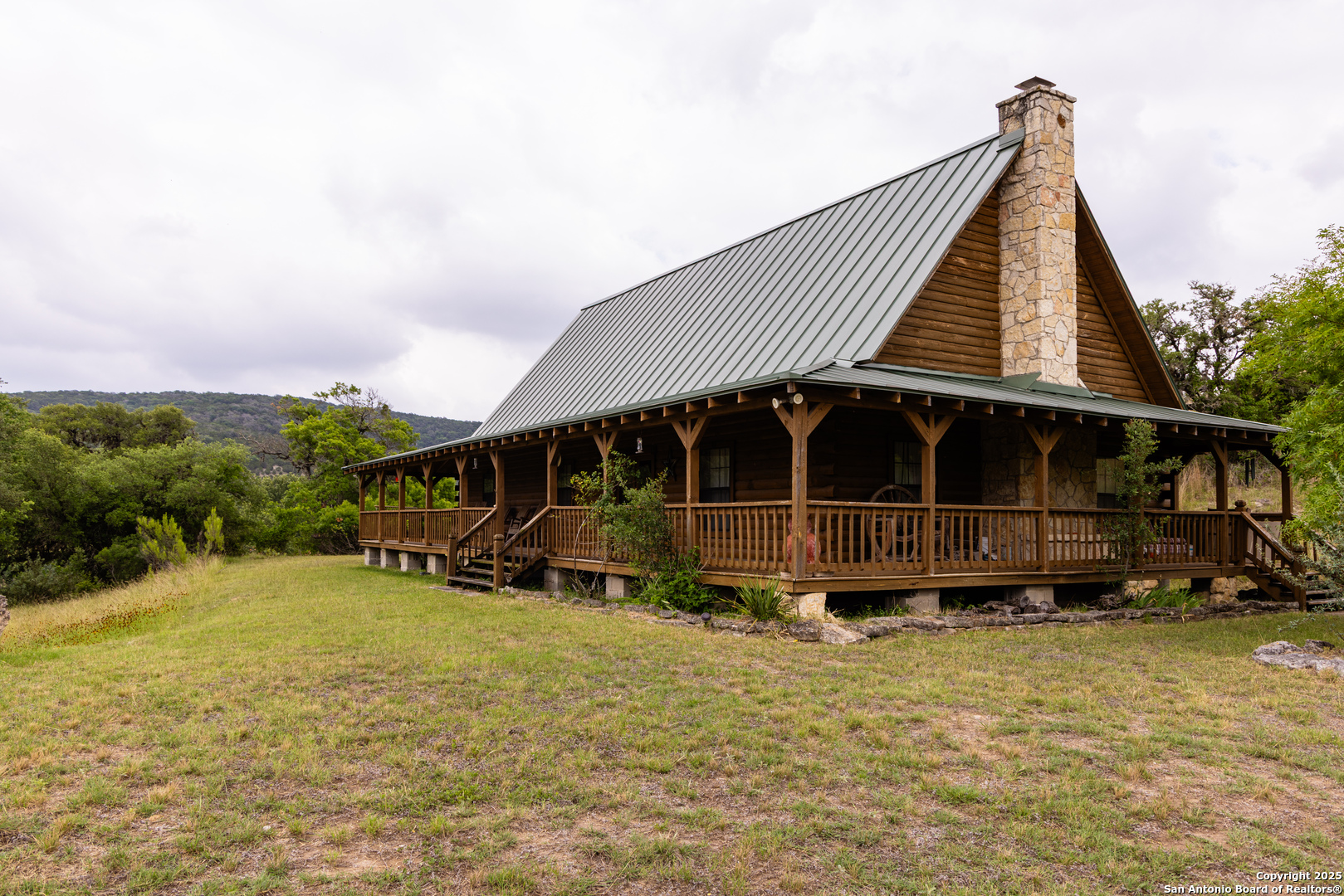 1616 Mickle Creek Road Medina, TX 78055 - Photo 6 of 18 a view of a house with a yard