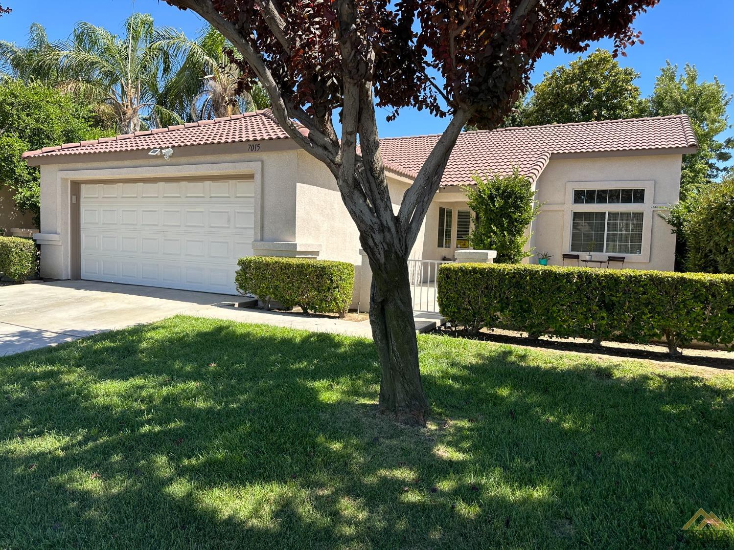 Undisclosed Address Bakersfield, CA 93313 - Photo 2 of 7 a front view of a house with a yard