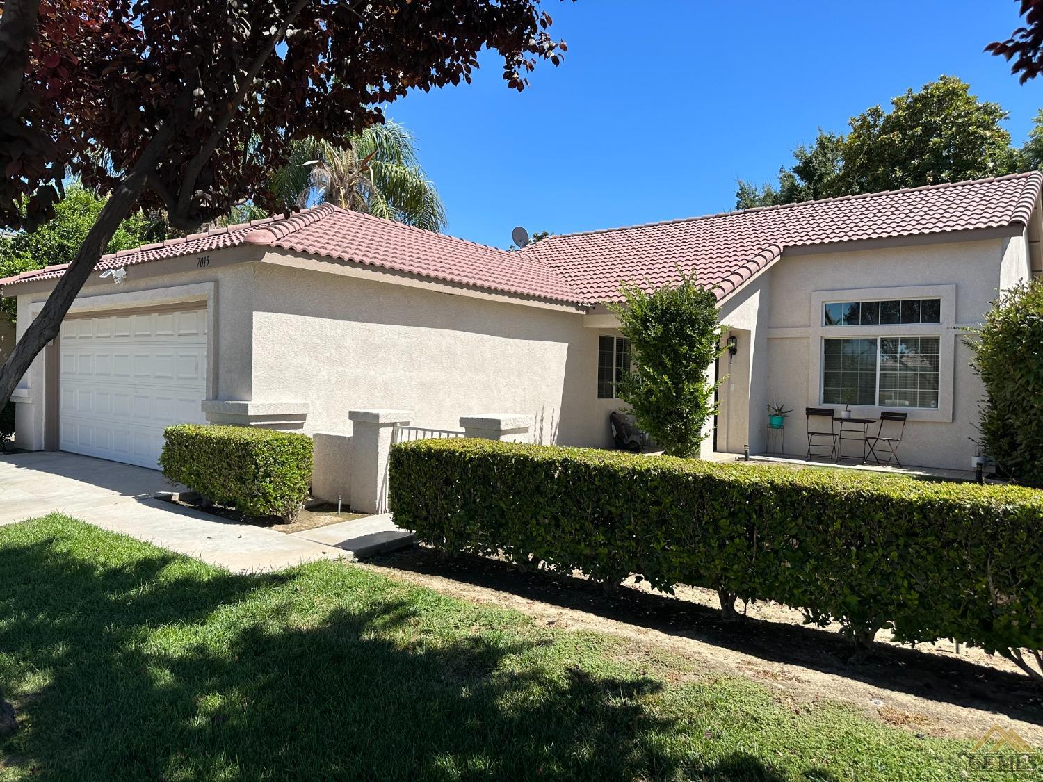 Undisclosed Address Bakersfield, CA 93313 - Photo 3 of 7 a front view of a house with a yard