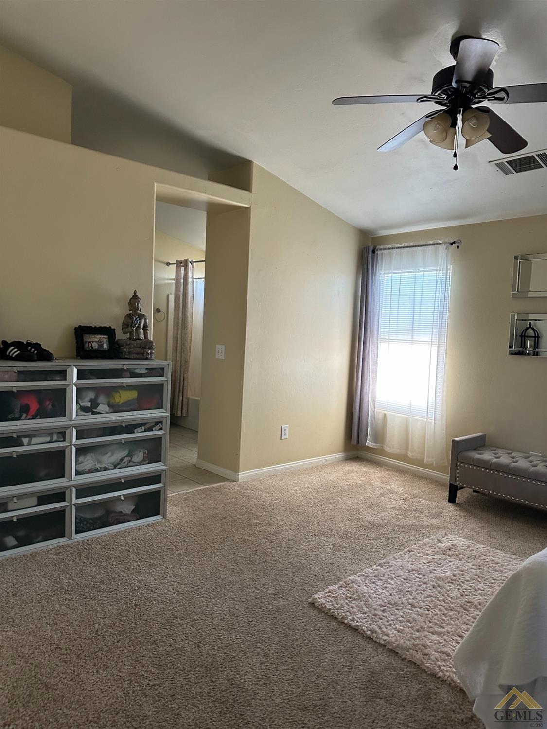 Undisclosed Address Bakersfield, CA 93313 - Photo 6 of 7 a view of empty room with stairs and a ceiling fan