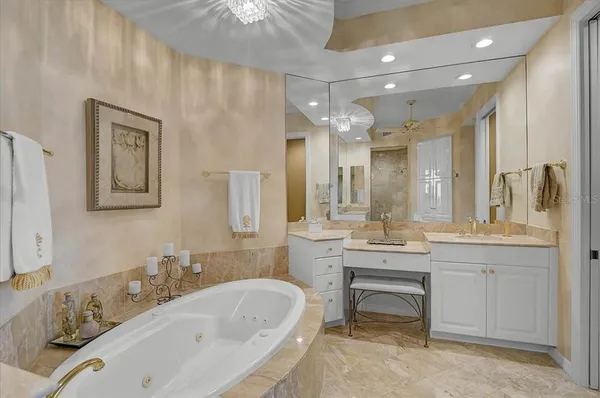 a bathroom with a granite countertop sink toilet a mirror and shower