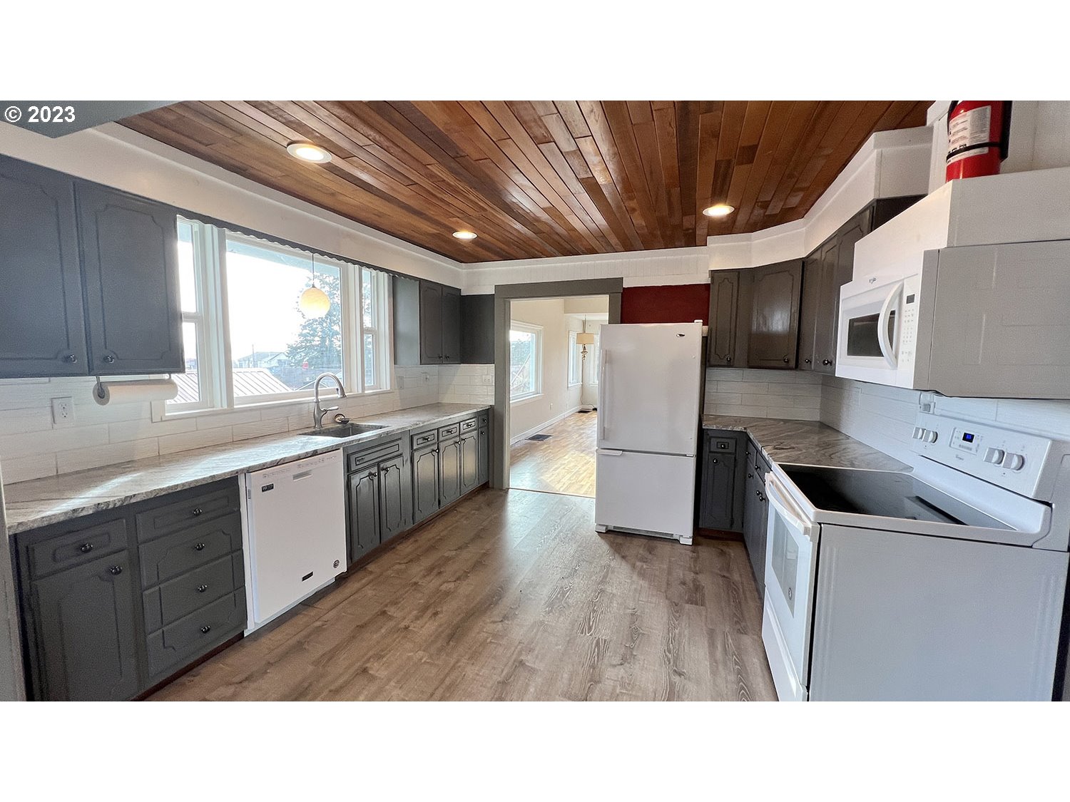 1832 4th Street Astoria, OR 97103 - Photo 4 of 4 a upper view of a kitchen with a sink a microwave and cabinets