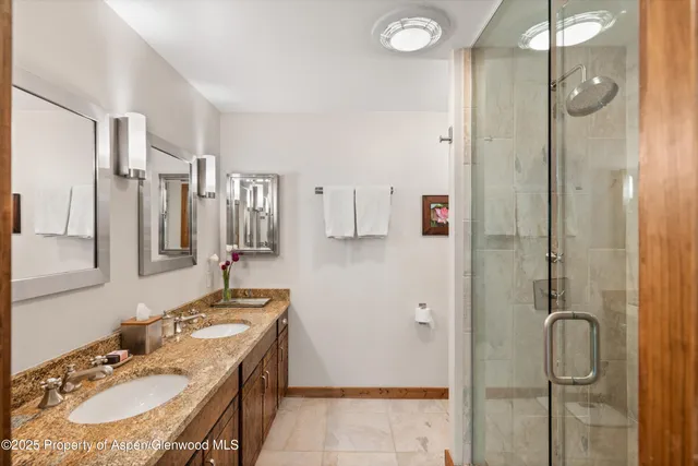 a bedroom with bed and a night stand