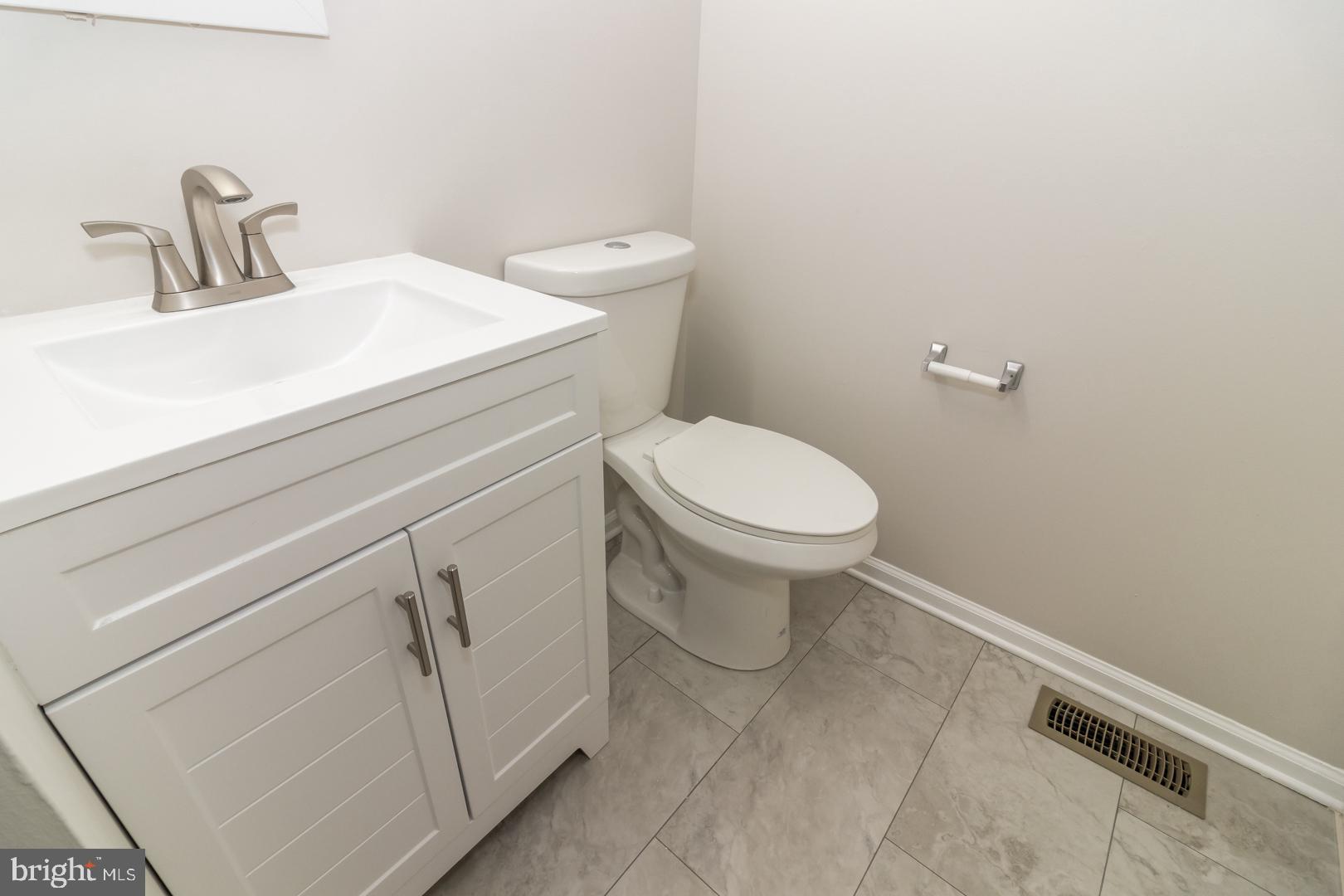 226 Hawthorne Way Riverside, NJ 08075 - Photo 26 of 32 a bathroom with a toilet sink and vanity