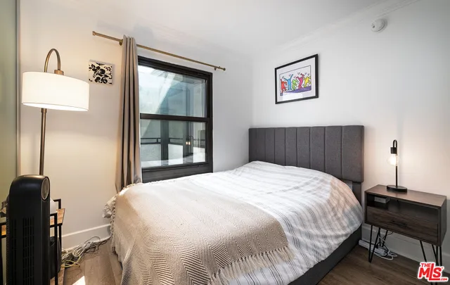 a bedroom with a bed and a table