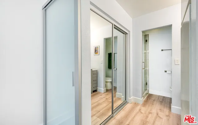 a view of hallway with wooden floor