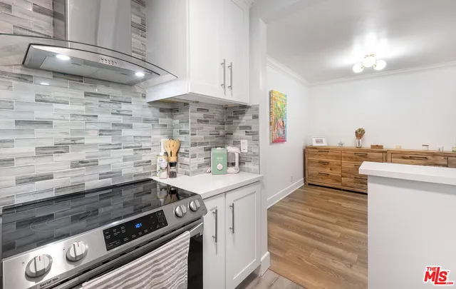 a kitchen with a stove and a sink