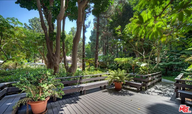 a view of a terrace with furniture and garden