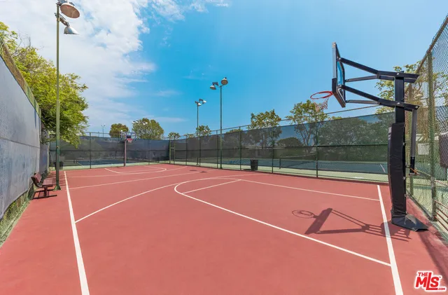 a view of a tennis court with a basket ball court