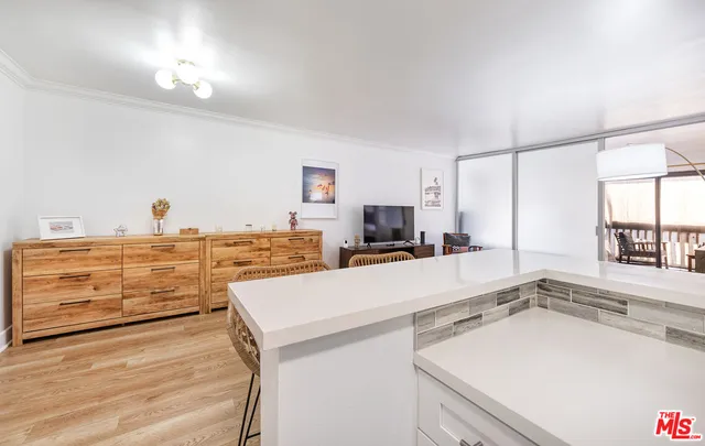a kitchen with a sink and a stove top oven