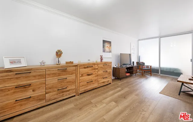 a bed room with a bed and a chair