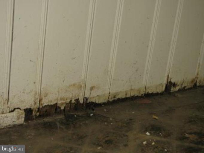 3733 Clarinth Road Baltimore, MD 21215 - Photo 4 of 5 an empty room with a wooden door