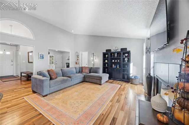 a large bedroom with a bed and a couch