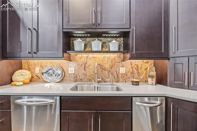 a sink with window and cabinets