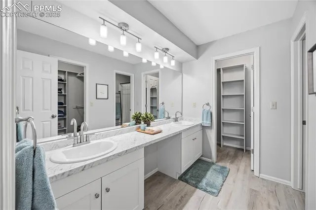 a bathroom with a sink double vanity and a mirror