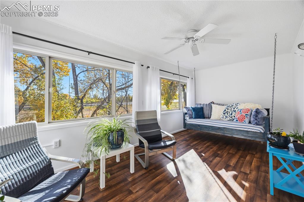 2135 Glenhill Road Colorado Springs, CO 80906 - Photo 28 of 50 a living room with furniture and a large window