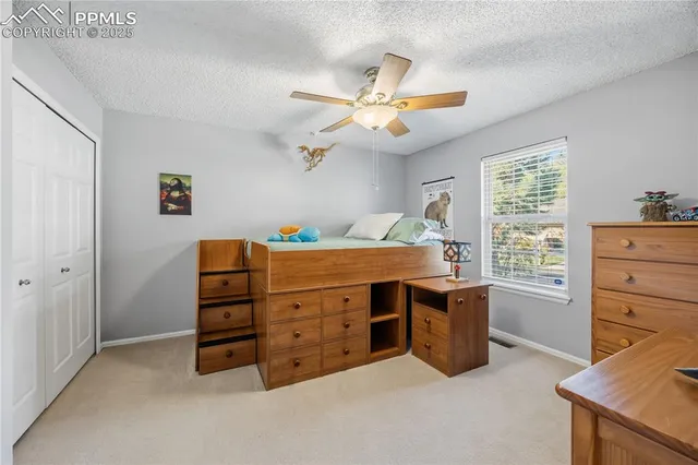 a room that has a dresser and a window