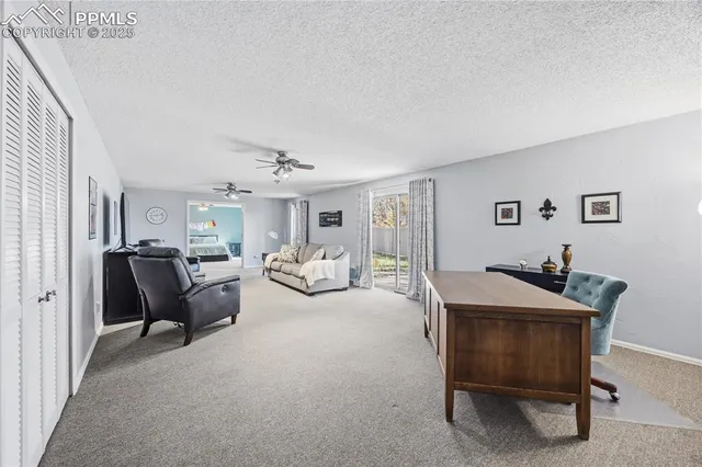 a living room with furniture and a table