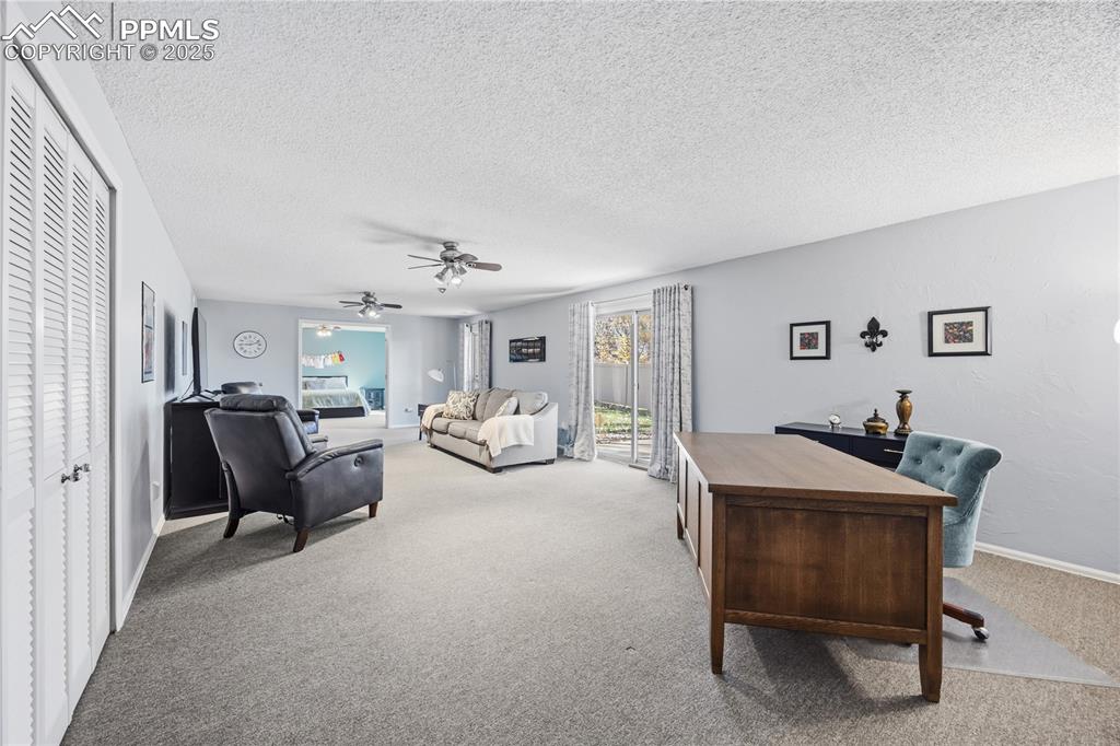 2135 Glenhill Road Colorado Springs, CO 80906 - Photo 34 of 50 a living room with furniture and a table
