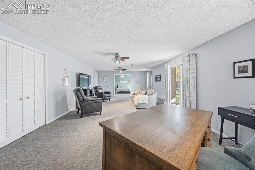 2135 Glenhill Road Colorado Springs, CO 80906 - Photo 35 of 50 a living room with furniture and a table