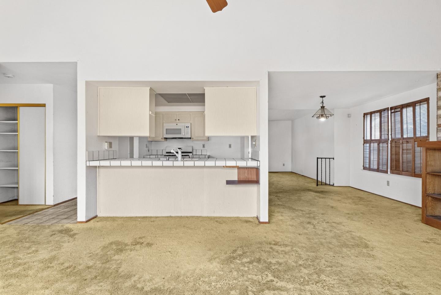 45811 Cheyenne Place Fremont, CA 94539 - Photo 20 of 44 a view of kitchen with stainless steel appliances granite countertop white cabinets and wooden floor