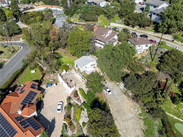 an aerial view of residential houses with outdoor space