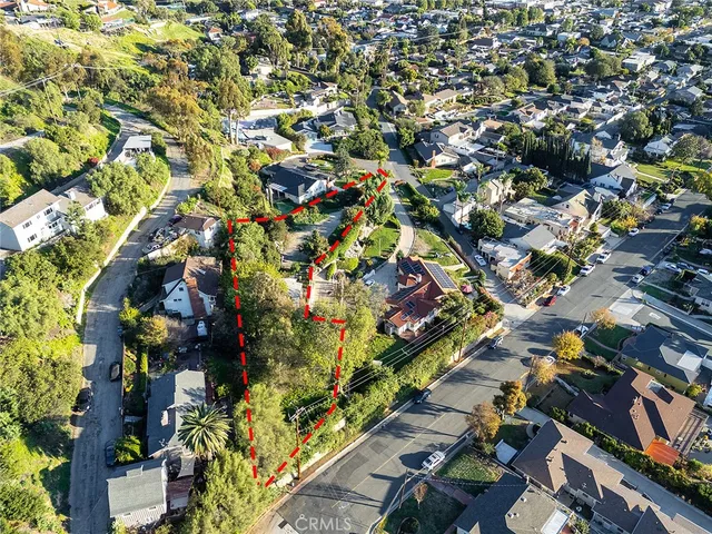 a view of a house with a yard and garden