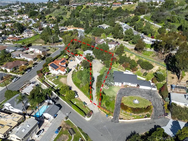 an aerial view of residential house with outdoor space