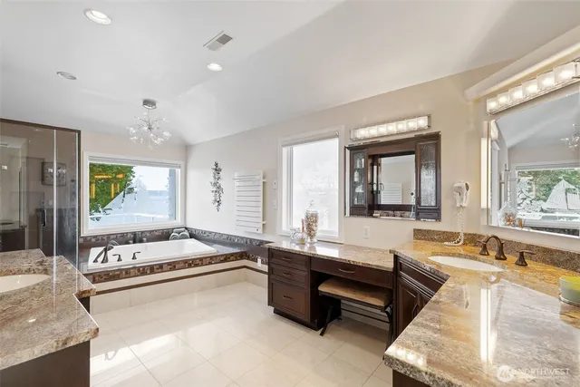 a large white kitchen with a large window