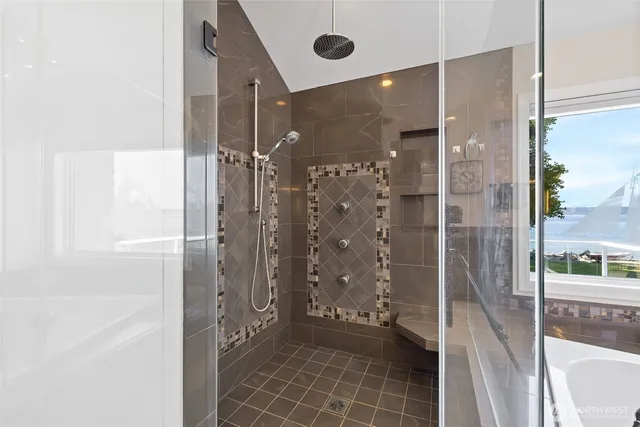 a bathroom with a glass shower door