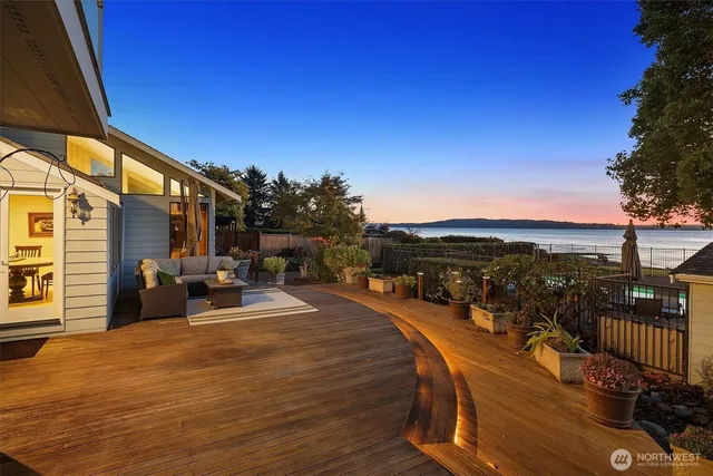 a view of a swimming pool with an outdoor seating