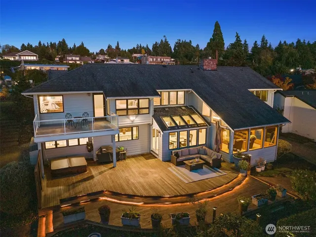 a view of a houses with a city from a balcony