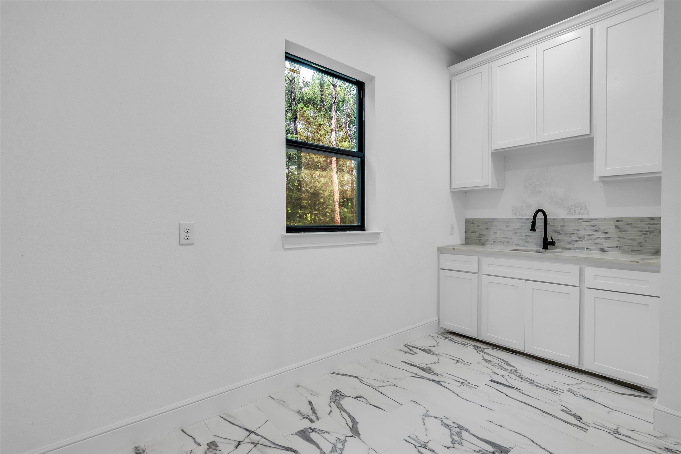 2 Deer Ridge Estates Boulevard Houston, TX 77339 - Photo 8 of 25 Utility Room featuring a convenient sink, ample cabinetry, and generous floor space for laundry and storage needs.
Elaboration:
This description highlights the functional elements of the space, focusing on its versatility and convenience. By mentioning both the sink and the significant amount of room, you inform potential buyers or renters that the area is not just for washing clothes, but also serves as a practical workspace for chores, potting plants, or organizing household supplies.