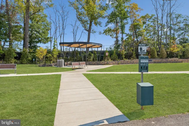 a view of a patio with a table and chairs