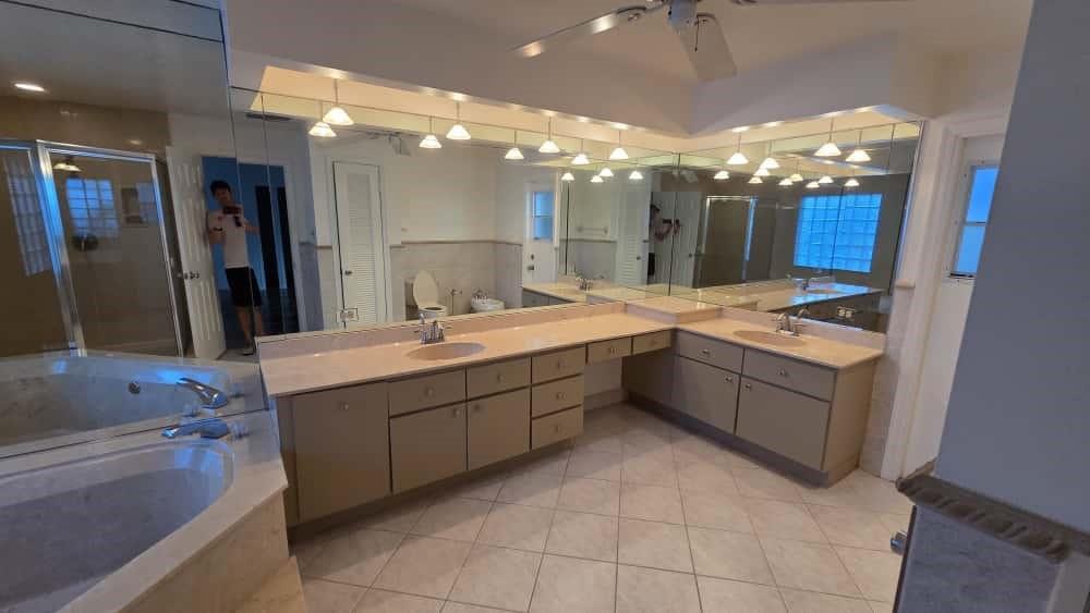 20167 Back 9 Drive Boca Raton, FL 33498 - Photo 11 of 28 a bathroom with a sink vanity and a mirror