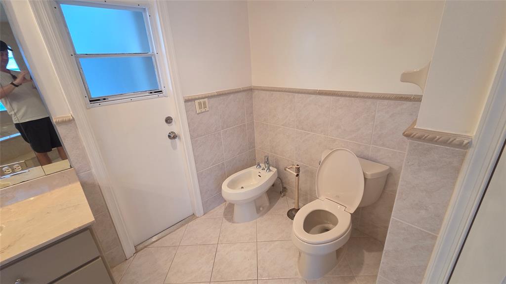 20167 Back 9 Drive Boca Raton, FL 33498 - Photo 17 of 28 a bathroom with a toilet and a shower