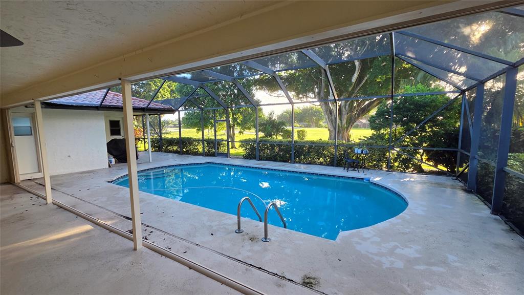 20167 Back 9 Drive Boca Raton, FL 33498 - Photo 18 of 28 a swimming pool with a outdoor seating and yard