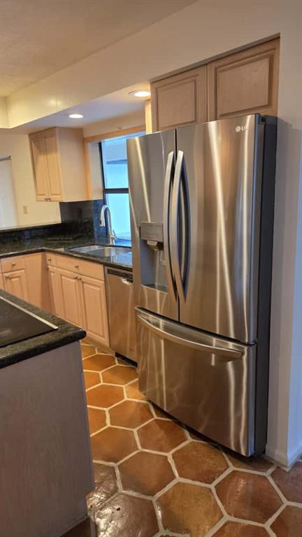 20167 Back 9 Drive Boca Raton, FL 33498 - Photo 21 of 28 a kitchen with stainless steel appliances granite countertop a refrigerator and a sink