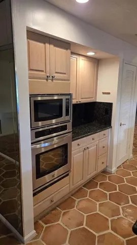 a view of a swimming pool with an outdoor seating