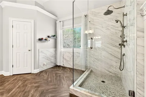 a bathroom with a bath tub and shower