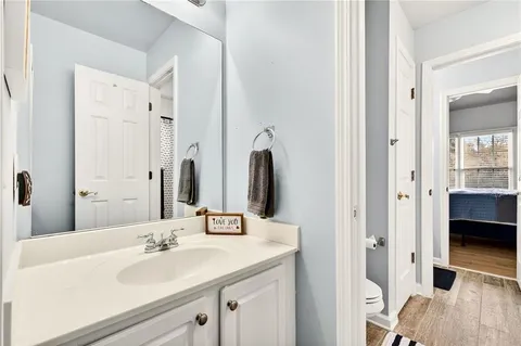 a bathroom with a sink vanity and a mirror